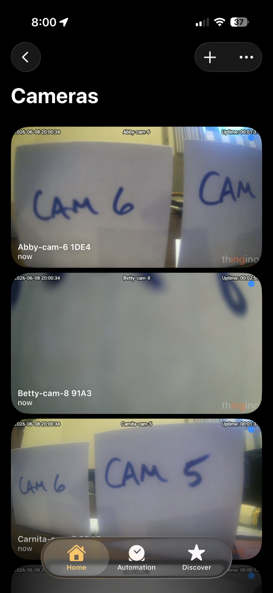 Apple Home iPhone camera list showing migrated thingino cameras as live camera tiles.